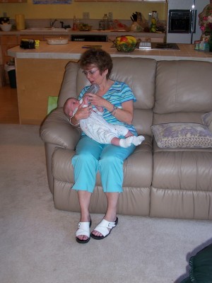 [Great-aunt Leigh feeding Owen]