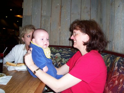 [Nancy holding Andrew at Buster's]