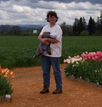 [Scott holding Andrew by the tulip fields]
